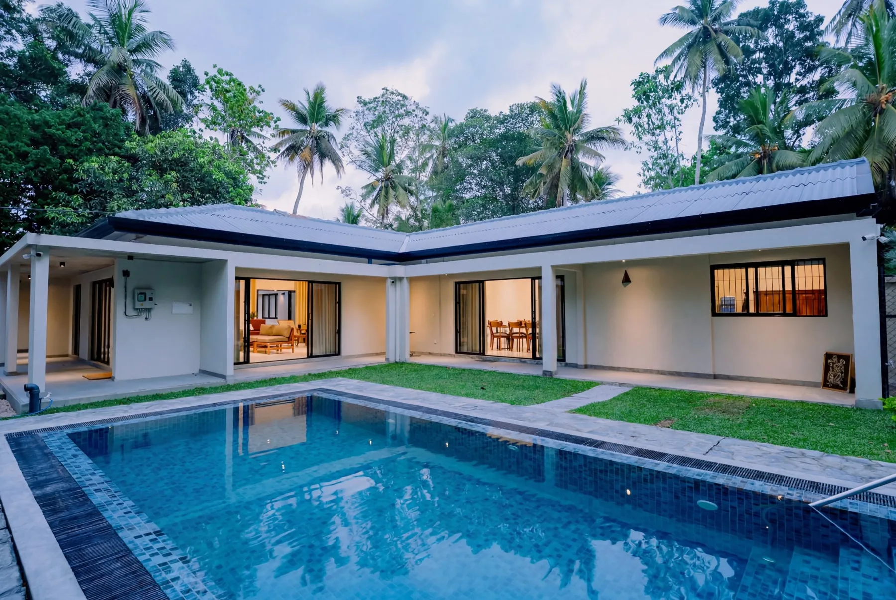 Private pool and tropical villa exterior